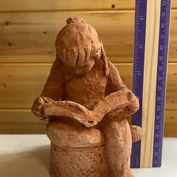 Local artist clay girl reading. - Picture 7 of 7